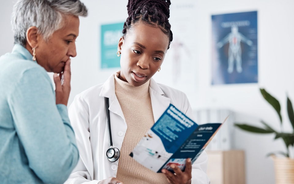 A patient and their doctor are going over P-tau217 testing questions