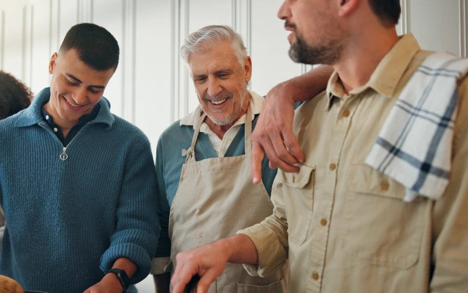 Family talking and cooking together