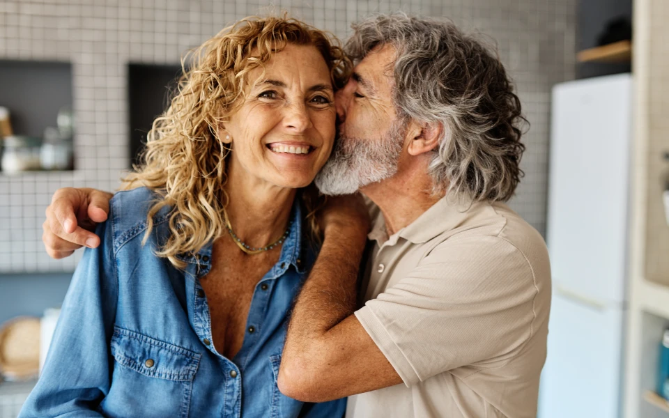 older couple smiling and being affectionate