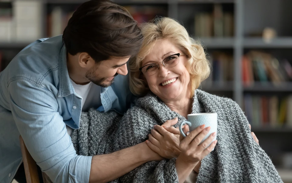 caregiver taking care of older woman